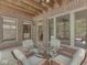 Sunroom features brick detail, wood ceiling and table with four chairs at 20 Forrests Edge Ct, Indianapolis, IN 46227