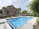 Large backyard pool, complemented by the brick house, green landscaping, and clear blue water at 20 Forrests Edge Ct, Indianapolis, IN 46227