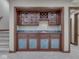 Dry bar area featuring cabinetry and a marble countertop with a sink at 20 Forrests Edge Ct, Indianapolis, IN 46227