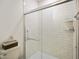 Modern bathroom with white subway tile, glass shower door, and brushed nickel hardware at 2125 Coretta Way, Indianapolis, IN 46202