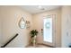 Bright entryway with frosted glass door, stylish decor, and seamless access to staircase at 2125 Coretta Way, Indianapolis, IN 46202