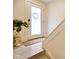 Bright entryway featuring frosted glass door, modern hardware, and elegant plant display at 2125 Coretta Way, Indianapolis, IN 46202