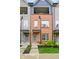 Charming townhome boasts red brick facade, modern design, inviting curb appeal, and balcony at 2125 Coretta Way, Indianapolis, IN 46202