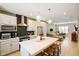 Stylish kitchen with a large island and seating, flowing into the living area at 2125 Coretta Way, Indianapolis, IN 46202