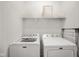 Clean and functional laundry room with a Maytag washer and dryer at 2125 Coretta Way, Indianapolis, IN 46202