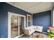 Relaxing covered patio featuring cozy seating and a view of the neighborhood at 2125 Coretta Way, Indianapolis, IN 46202