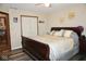 Cozy bedroom featuring a wood sleigh bed, ceiling fan and closet with ample space at 254 Bittersweet Dr, Whiteland, IN 46184