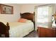 Well-lit bedroom featuring a twin bed, natural light, and wood dresser at 254 Bittersweet Dr, Whiteland, IN 46184