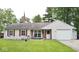 Charming single-story home featuring a well-manicured lawn, red shutters, and a cozy front porch at 254 Bittersweet Dr, Whiteland, IN 46184