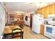 Open kitchen featuring ample cabinet space, modern appliances, and a large dining area at 254 Bittersweet Dr, Whiteland, IN 46184