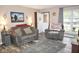 Comfortable living room with neutral decor, plush seating, and plenty of natural light at 254 Bittersweet Dr, Whiteland, IN 46184