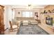 Comfortable living room with large sectional couch, fireplace and ceiling fan at 254 Bittersweet Dr, Whiteland, IN 46184