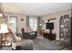 A cozy living room area filled with natural light, comfortable seating, and homely decor at 254 Bittersweet Dr, Whiteland, IN 46184