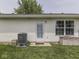 View of the backyard showcasing the lawn and white siding of the house at 2756 Branigin Creek Blvd, Franklin, IN 46131