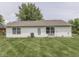 View of the backyard showcasing the lawn and white siding of the house at 2756 Branigin Creek Blvd, Franklin, IN 46131