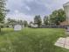 Large fenced backyard with green grass and an outbuilding at 2756 Branigin Creek Blvd, Franklin, IN 46131