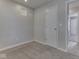Bedroom with neutral colored walls and carpet and a view to the doorway and bedroom beyond at 2756 Branigin Creek Blvd, Franklin, IN 46131