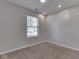 Cozy bedroom with a neutral color scheme, plush carpeting and natural light from the window at 2756 Branigin Creek Blvd, Franklin, IN 46131