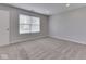 Neutral bedroom featuring wall-to-wall carpeting and a window for natural light at 2756 Branigin Creek Blvd, Franklin, IN 46131