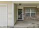 Covered front entrance featuring brick accents and a secure screen door at 2756 Branigin Creek Blvd, Franklin, IN 46131