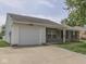 Charming single-story home with a brick facade, manicured lawn, and attached one car garage at 2756 Branigin Creek Blvd, Franklin, IN 46131