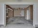 Spacious two car garage with shelving installed around the perimeter of the garage at 2756 Branigin Creek Blvd, Franklin, IN 46131
