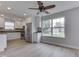 Open-concept kitchen boasts stainless steel appliances, white cabinetry, and a large window at 2756 Branigin Creek Blvd, Franklin, IN 46131