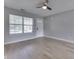Bright, spacious living room featuring modern flooring, a ceiling fan and a front window at 2756 Branigin Creek Blvd, Franklin, IN 46131