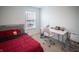 Bright bedroom with a gray headboard bed, white desk, and natural light from the window at 2916 W Bargello Ln, Monrovia, IN 46157