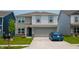 Charming two-story home featuring neutral siding, a two-car garage, and a well-manicured front lawn at 2916 W Bargello Ln, Monrovia, IN 46157
