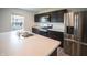 Modern kitchen featuring stainless steel appliances, dark cabinets, and a center island at 2916 W Bargello Ln, Monrovia, IN 46157