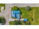 Aerial view of the property with a new blue metal roof, shed, deck, and large backyard at 300 N Church St, Arcadia, IN 46030