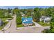 Aerial image showcasing the house with a blue metal roof, charming front porch, and neighborhood setting at 300 N Church St, Arcadia, IN 46030