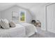 Bright bedroom features soft carpet and a window at 300 N Church St, Arcadia, IN 46030