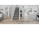 Spacious entryway with stylish flooring and a staircase that leads to the next floor at 300 N Church St, Arcadia, IN 46030