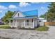 Attractive home features a new blue metal roof and inviting front porch for relaxing outdoors at 300 N Church St, Arcadia, IN 46030