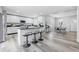 Open kitchen featuring an island with seating, stainless steel appliances, and modern finishes at 300 N Church St, Arcadia, IN 46030