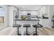 Bright kitchen featuring a breakfast bar, sleek countertops, and stainless steel appliances at 300 N Church St, Arcadia, IN 46030