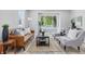 Inviting living room featuring neutral tones and natural light, perfect for relaxation and entertainment at 300 N Church St, Arcadia, IN 46030