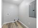 Utility room with sleek floors, convenient hookups, and updated electrical panel at 300 N Church St, Arcadia, IN 46030