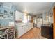 Functional kitchen featuring white cabinets, brick flooring, and ample counter space at 3004 Sheridan St, Anderson, IN 46016