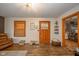 Spacious living room with hardwood floors, decorative lighting, and open floor plan leading to the kitchen at 3004 Sheridan St, Anderson, IN 46016
