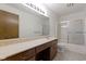 Bathroom featuring a large vanity with a long sink, toilet, and walk-in shower at 310 W Jackson St, Alexandria, IN 46001