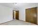 Bedroom featuring neutral carpet, light walls, and a closet at 310 W Jackson St, Alexandria, IN 46001