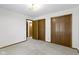 Bedroom featuring neutral carpet, light walls, and a closet at 310 W Jackson St, Alexandria, IN 46001