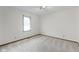 A neutral bedroom with light colored walls and carpet and window with blinds at 310 W Jackson St, Alexandria, IN 46001