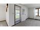 Bright entryway with neutral carpet and views of the outdoors through a glass-paneled door at 310 W Jackson St, Alexandria, IN 46001