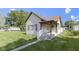 Charming home featuring a cozy front porch, well-kept lawn, and classic architectural details at 310 W Jackson St, Alexandria, IN 46001