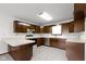 Functional kitchen featuring ample wood cabinetry, white countertops, and modern appliances at 310 W Jackson St, Alexandria, IN 46001