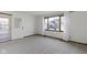 Well-lit living room with carpet flooring, natural light, and white walls at 310 W Jackson St, Alexandria, IN 46001